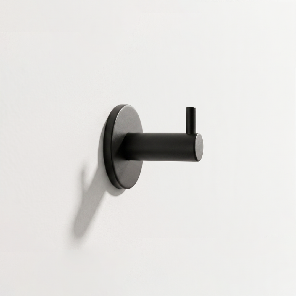 AHI Wall Hook with Pin in black installed on a white wall