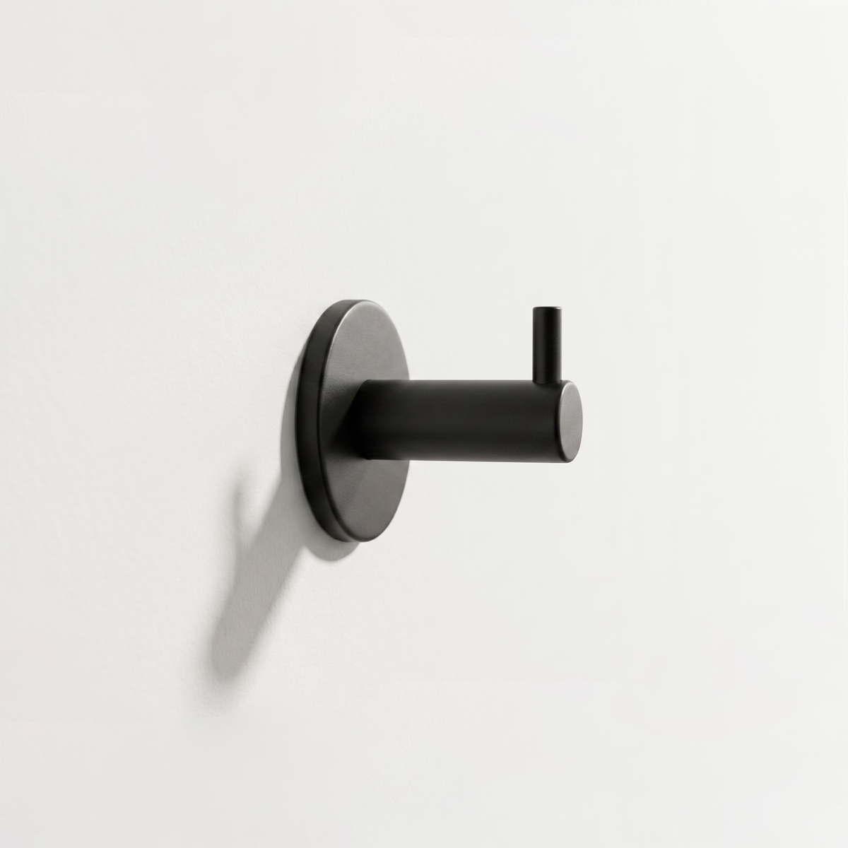 AHI Wall Hook with Pin in black installed on a white wall
