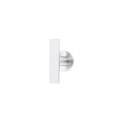 An ARC Cupboard Knob by Formani on a white wall.