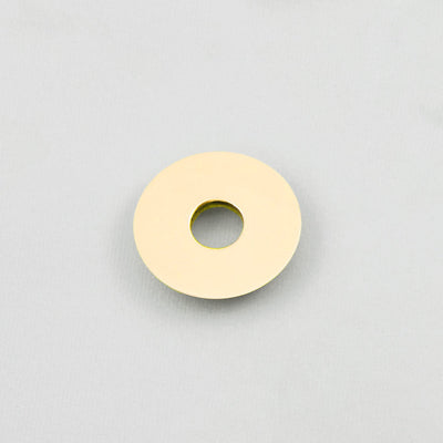 A Maison Vervloet Audrey Door Knob 70, a white object with a hole in the middle of it.