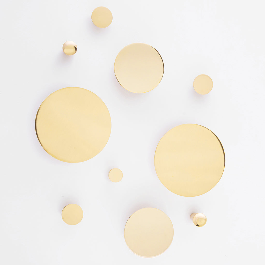 A group of Maison Vervloet's Audrey Knob 30 circles on a white surface.