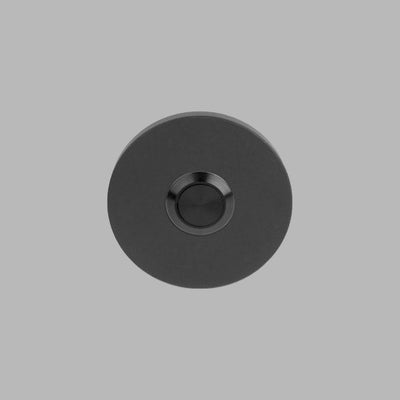 A Formani BASICS Doorbell LB50 with a black object and a white background.