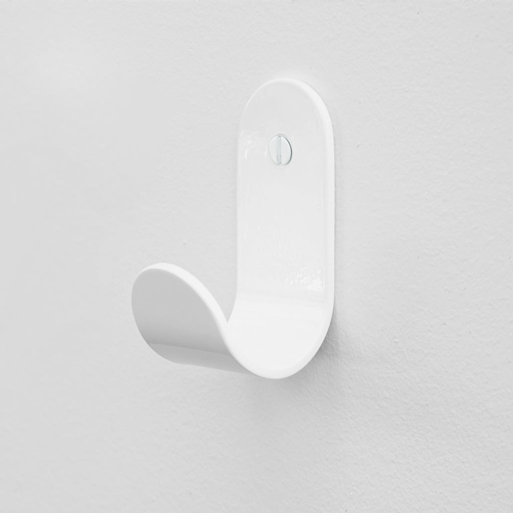 The Bende Hook 1 from CSSN in gloss white with flat head screw installed on white wall