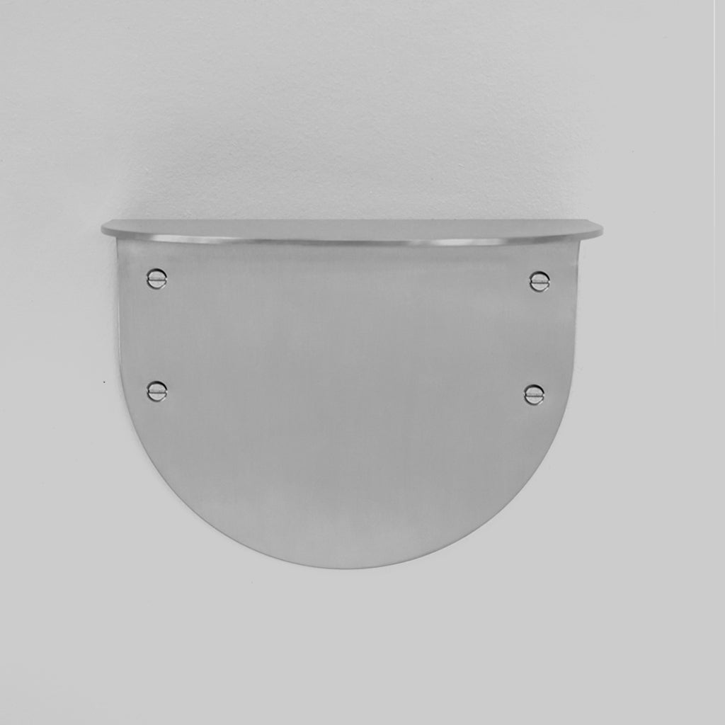 A white wall with a CSSN BENDE Shelf Ledge on it.