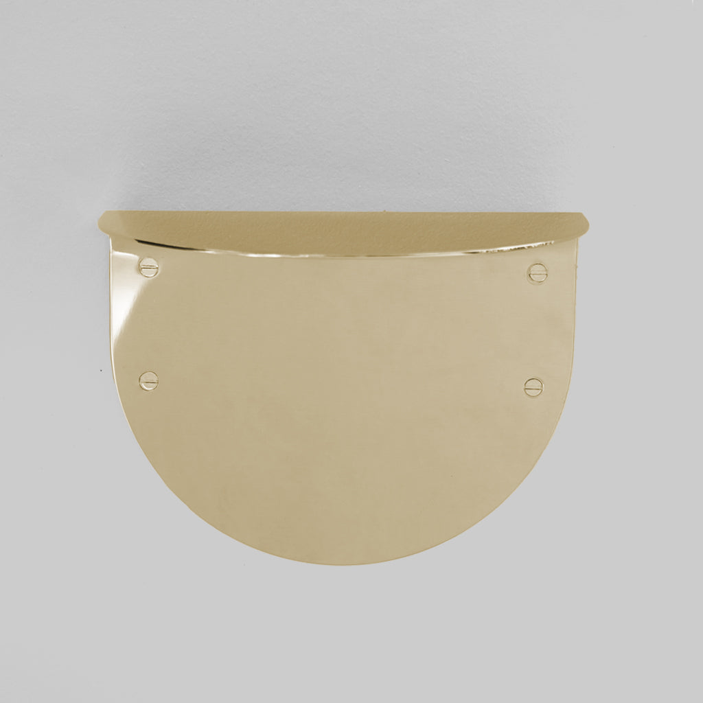 A BENDE Shelf Ledge by CSSN hanging on a white wall.