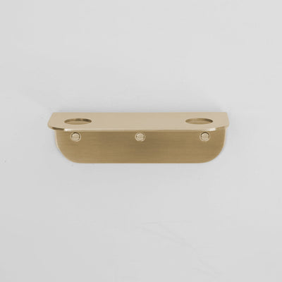 Bende Double Soap Holder in satin brass mounted on white wall with 3 slot head screws