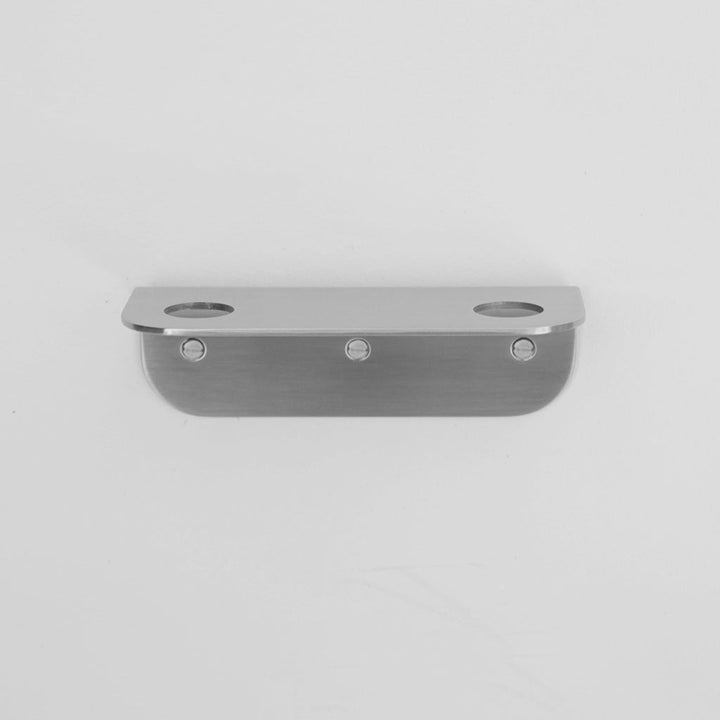 Bende Double Soap Holder in satin stainless steel mounted on white wall with 3 slot head screws