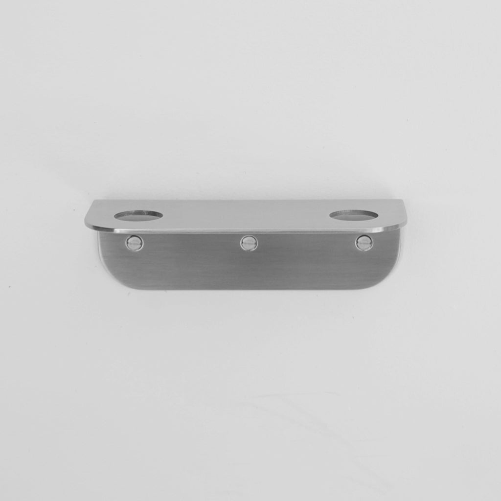 Bende Double Soap Holder in satin stainless steel mounted on white wall with 3 slot head screws