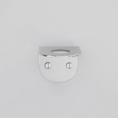 A CSSN BENDE Soap Holder Bracket Single with two eyes on a white wall.