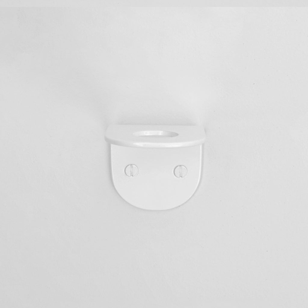 A close up of a CSSN BENDE Soap Holder Bracket Single on a wall.