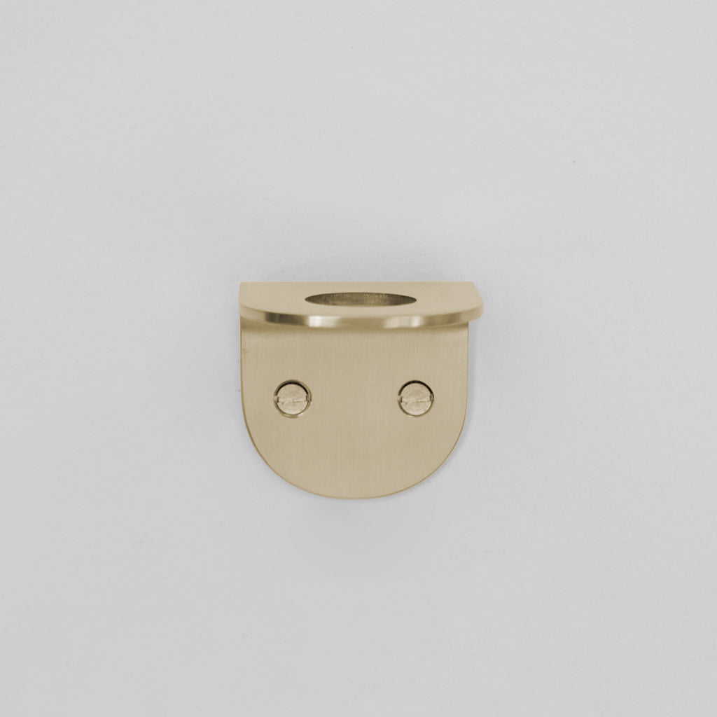 A CSSN BENDE Soap Holder Bracket Single with two holes in the middle.