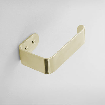 A BENDE Toilet Roll Holder by CSSN on a white wall.