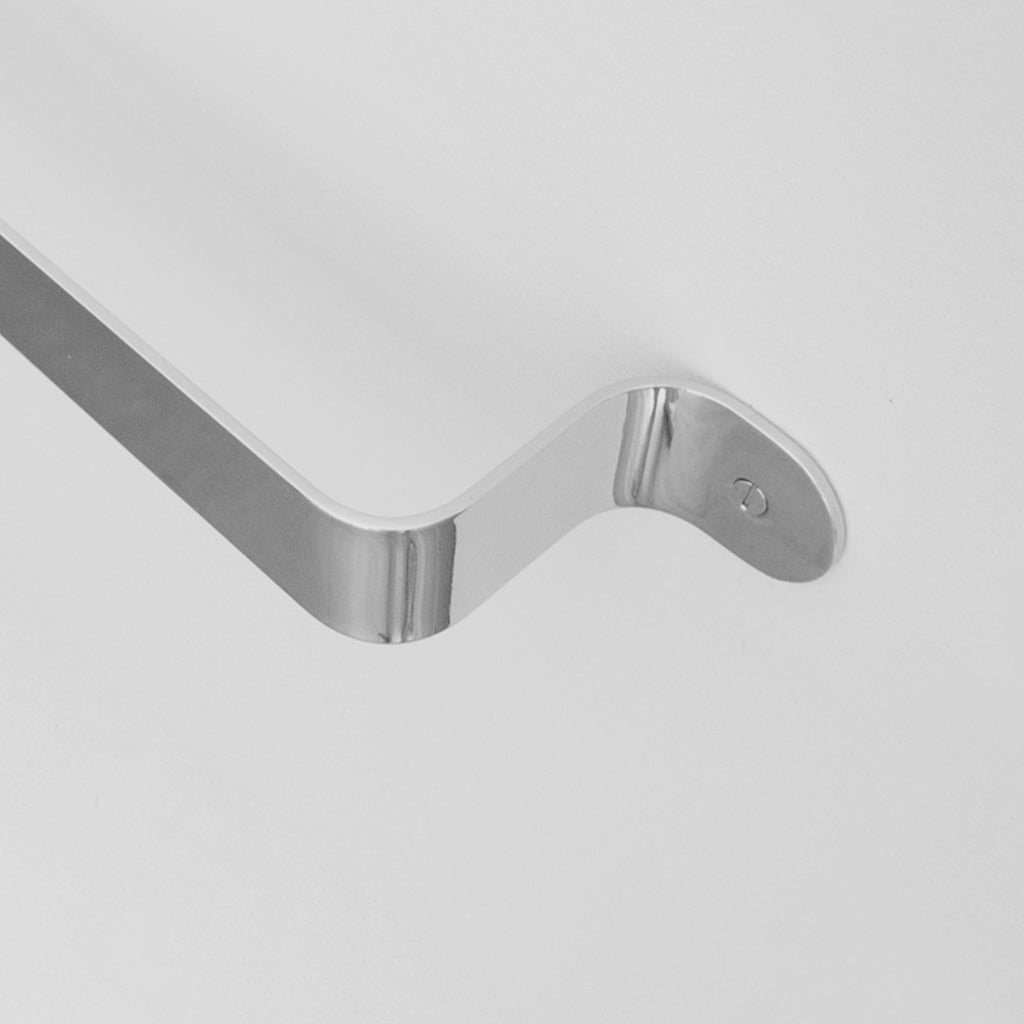 Bende Polished Stainless Steel Towel Bar Installed on white wall detail of curve