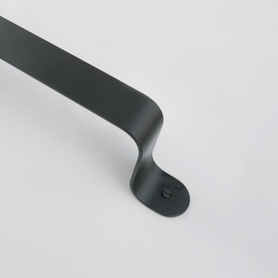 Bende Matte Powder Coated Black Towel Bar Installed on white wall detail of curve