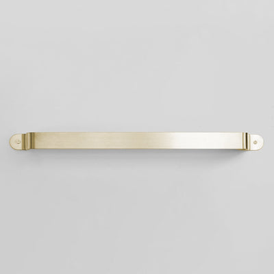 Bende Satin Brass Towel Bar Installed on white wall