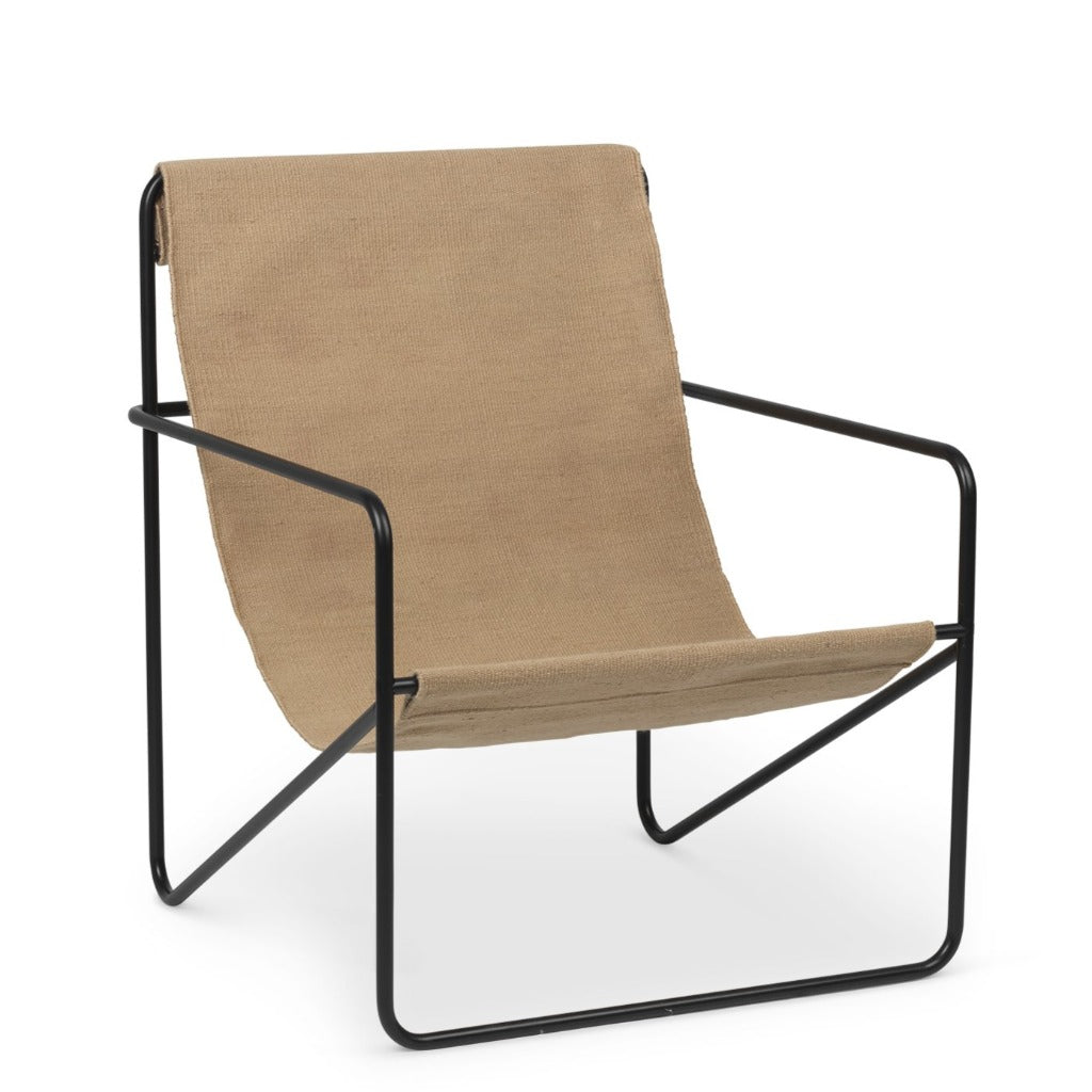 A Ferm Living Black Solid Desert Lounge Chair with a tan seat and black frame.