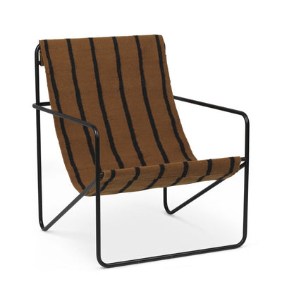A Black Stripe Desert Lounge Chair by Ferm Living with a black frame.