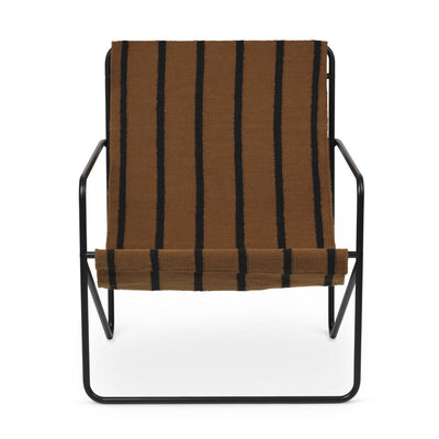A Black Stripe Desert Lounge Chair with a Ferm Living black frame.