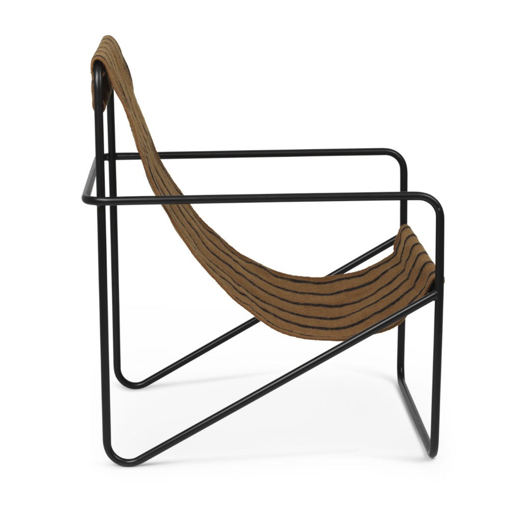 A Black Stripe Desert Lounge Chair by Ferm Living with a wooden seat and metal frame.