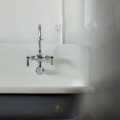 A Bocci 22: Alternate Material Mounting sink with a Bocci faucet.