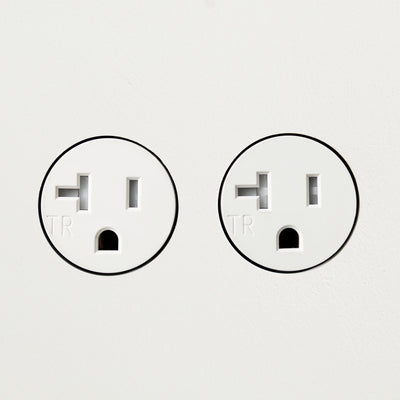 A couple of Bocci 22: Drywall Mud-In Mounting plugs sitting next to each other.