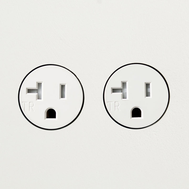 A couple of Bocci 22: Drywall Mud-In Mounting plugs sitting next to each other.
