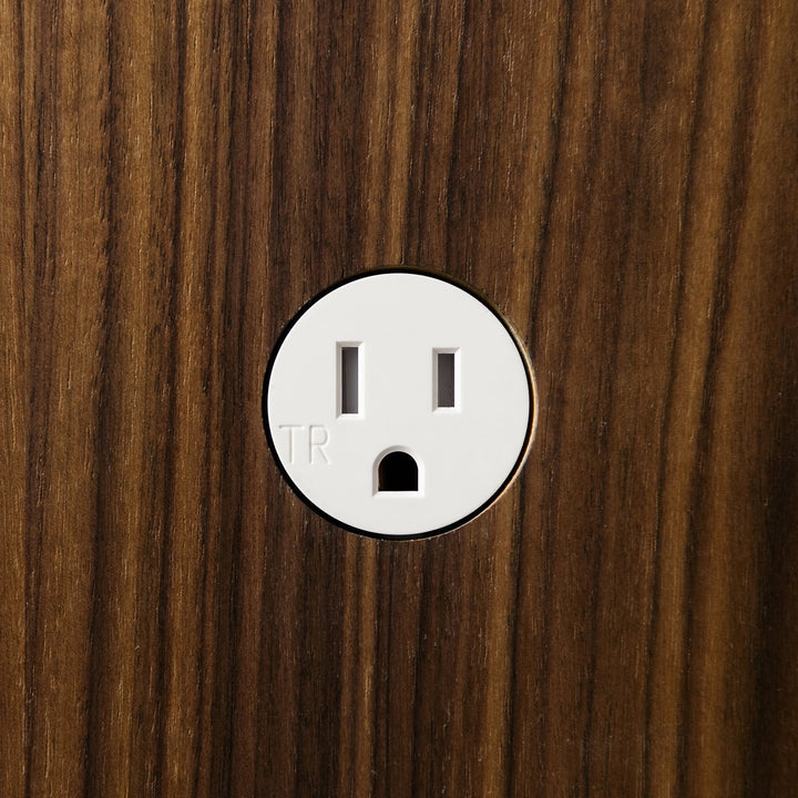 A close up of a wooden surface with a Bocci 22: Alternate Material Mounting light switch.