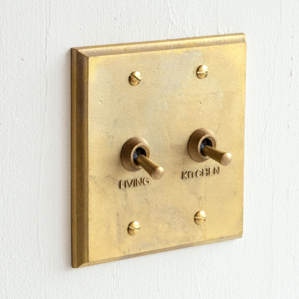 BRASS LIGHT SWITCH COVERS. SAND CAST WITH TOGGLES