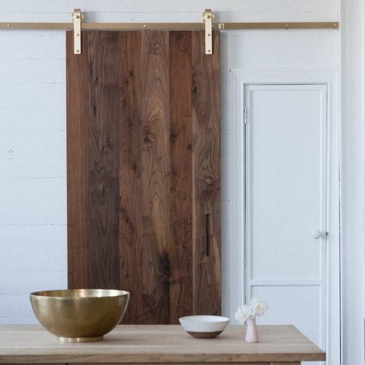 Beautiful modern and contemporary brass barn door hardware. Made in Canada