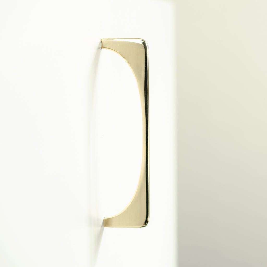 A close up of a Baccman Berglund Bridge Pull on a white wall.