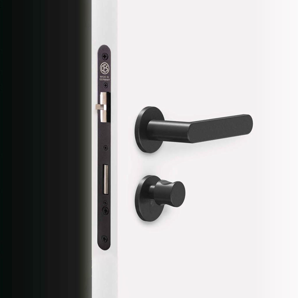 A close up of a CES Key Cylinder 815 Knob CT door handle on a door.