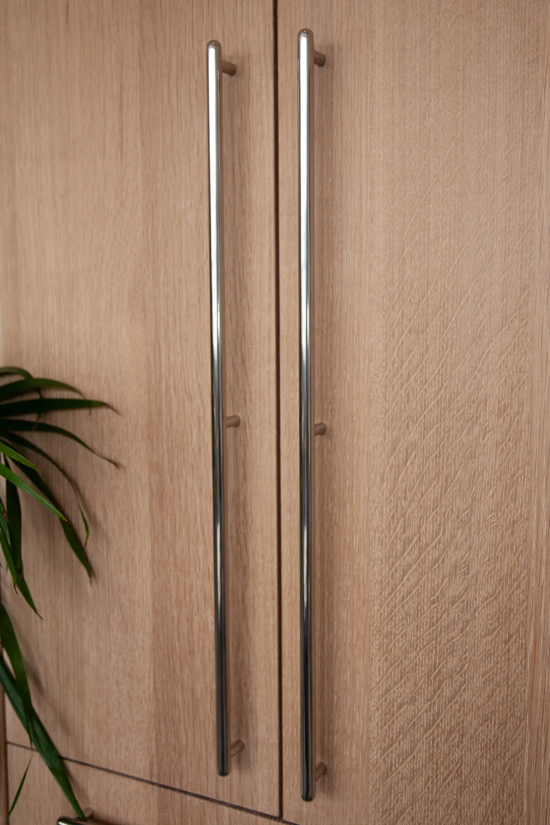 Solid brass knob with developing patina on cabinetry