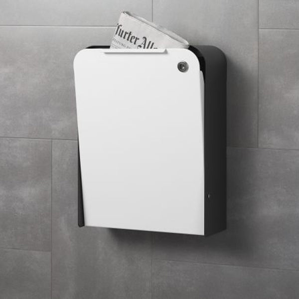 A Serafini Cap Mailbox dispenser mounted to a wall.