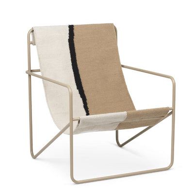 A Ferm Living Cashmere Soil Desert Lounge Chair with a beige and black stripe on it.