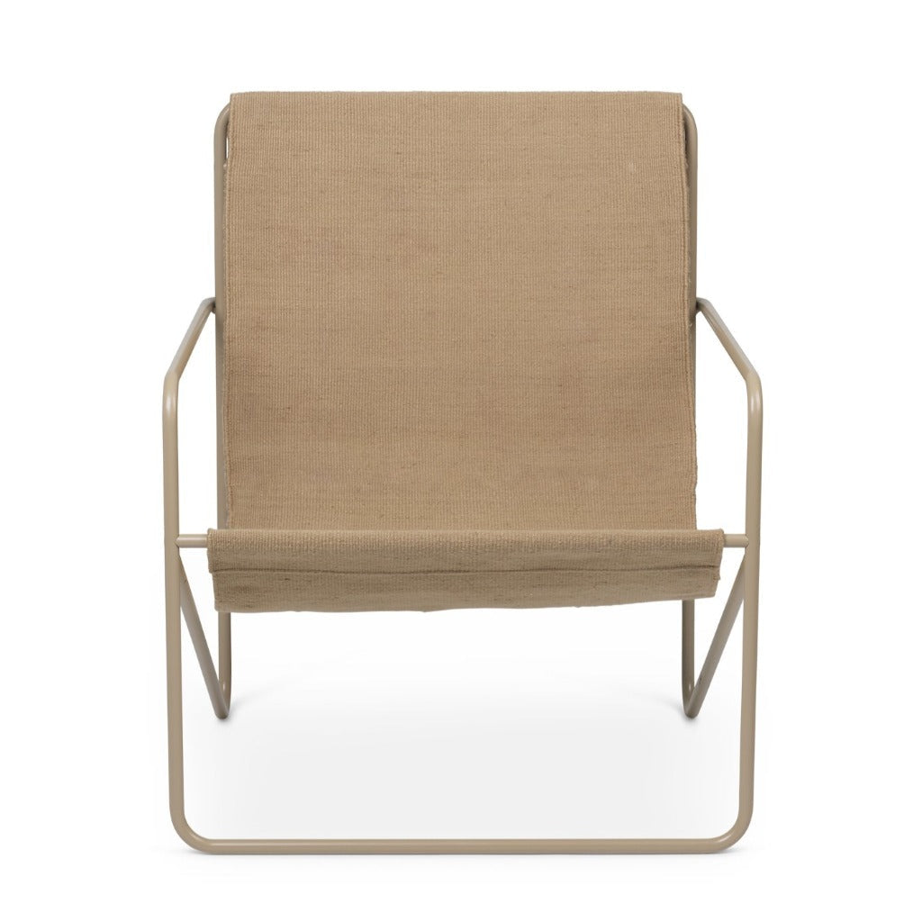 A Cashmere Solid Desert Lounge Chair by Ferm Living with a tan seat and a white background.