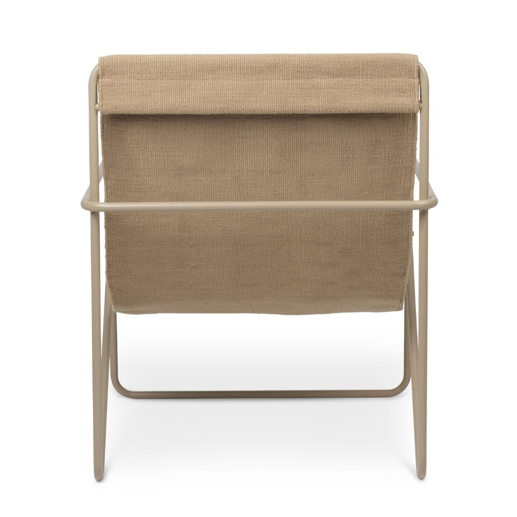 A Ferm Living Cashmere Solid Desert Lounge Chair with a wooden frame.