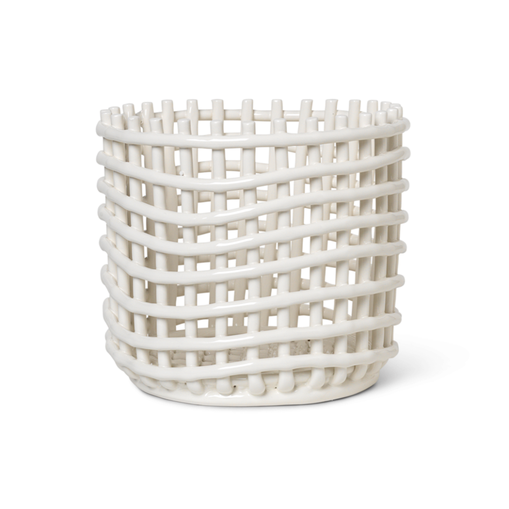 A white Ceramic Woven Basket vase with a lattice design on it by Ferm Living.