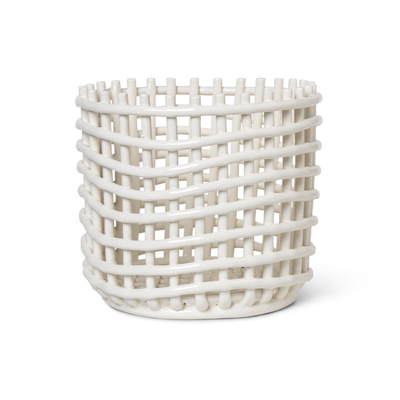 A white Ceramic Woven Basket vase with a lattice design on it by Ferm Living.