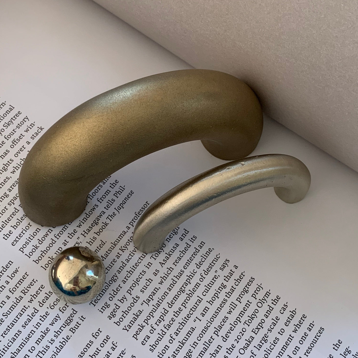 solid cast natural and white brass and bronze small cabinet hardware knob and handle by Maha Alavi