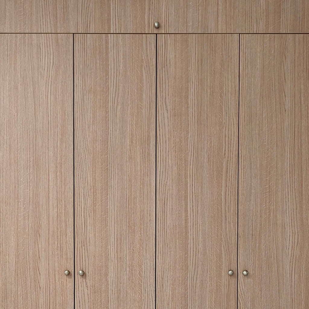 A wood wardrobe fitted with Maha Alavi Cercle knobs or pulls.