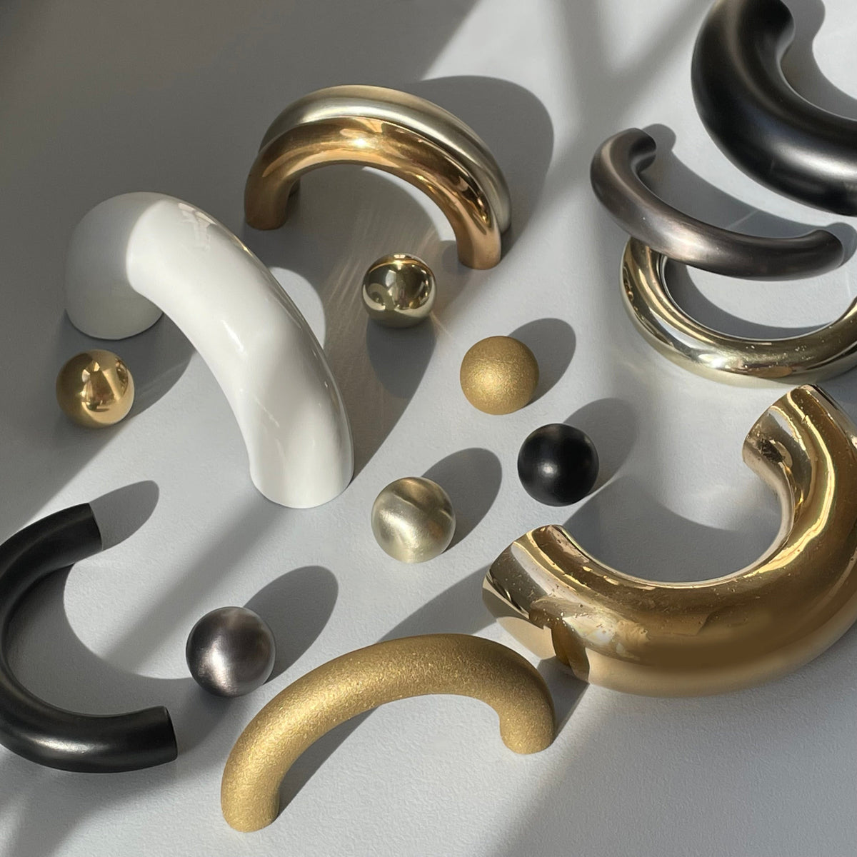 solid cast natural and white brass and bronze small cabinet hardware knob and handle by Maha Alavi