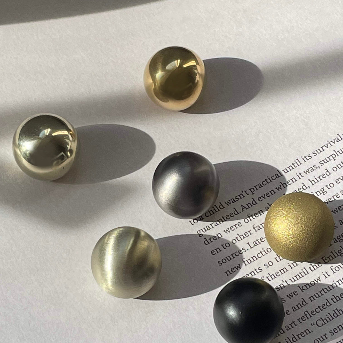 solid cast natural and white brass and bronze small cabinet hardware knob and handle by Maha Alavi