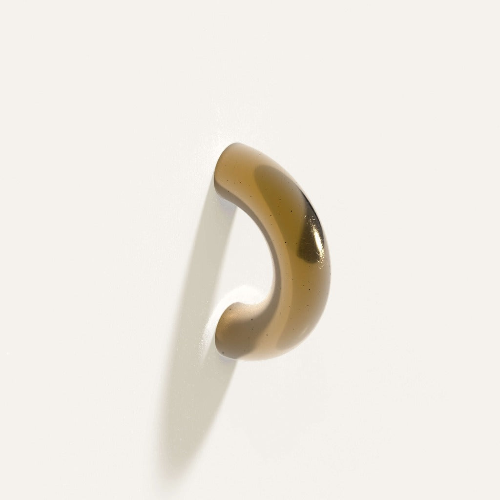 Amber Maha Alavi Cercle thick pull, a glossy cast half-circle arc.