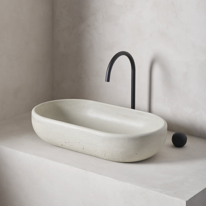 An oversized, obround washbowl with softened curves and high, round-over basin walls