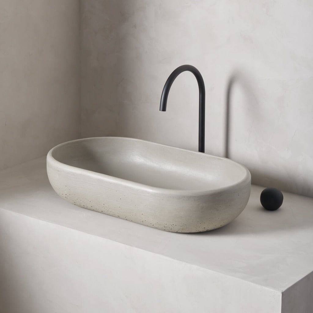 An oversized, obround washbowl with softened curves and high, round-over basin walls