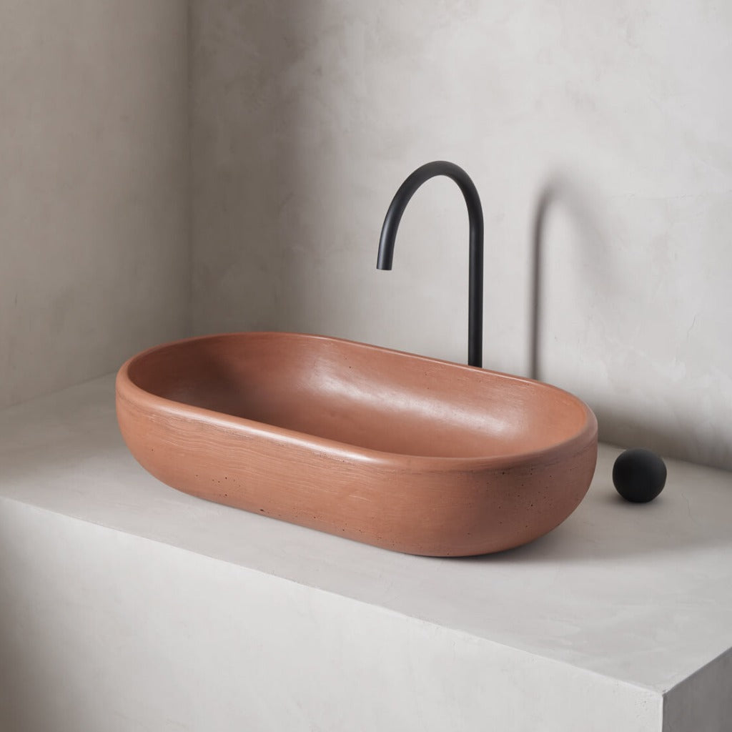 An oversized, obround washbowl with softened curves and high, round-over basin walls