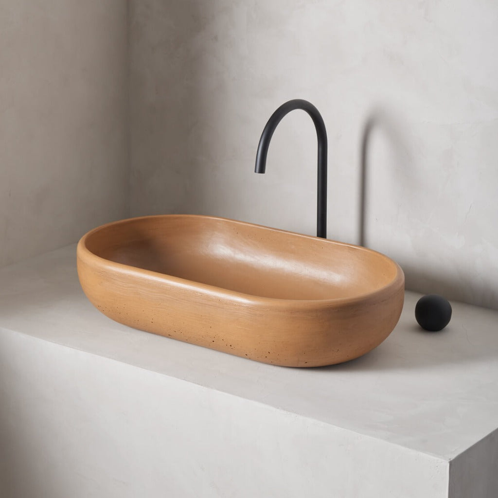 An oversized, obround washbowl with softened curves and high, round-over basin walls