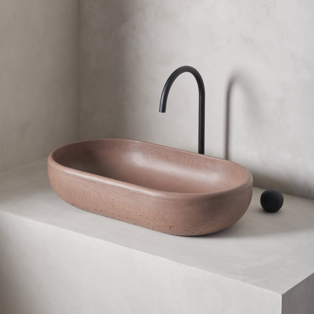 An oversized, obround washbowl with softened curves and high, round-over basin walls