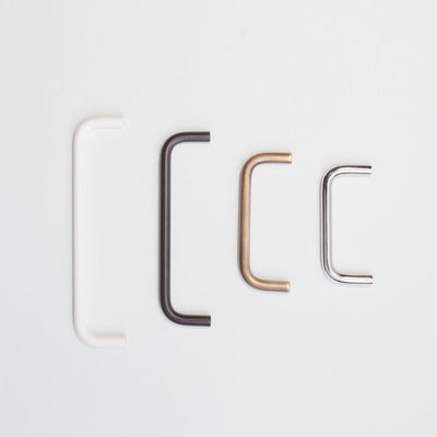 A variety of Charlie Bar Pull Handles in different sizes and finishes placed in order by size..