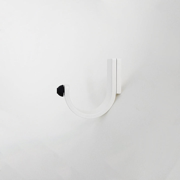 A CBH Charlie Bumper Hook on a white wall.